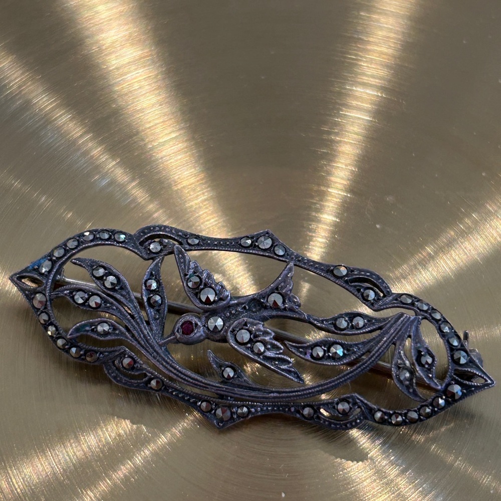 Elegant Black Brooch with Intricate Design